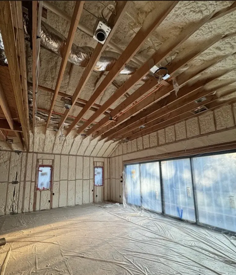 Interior walls and ceiling insulated with spray foam during new construction in Silver Lake